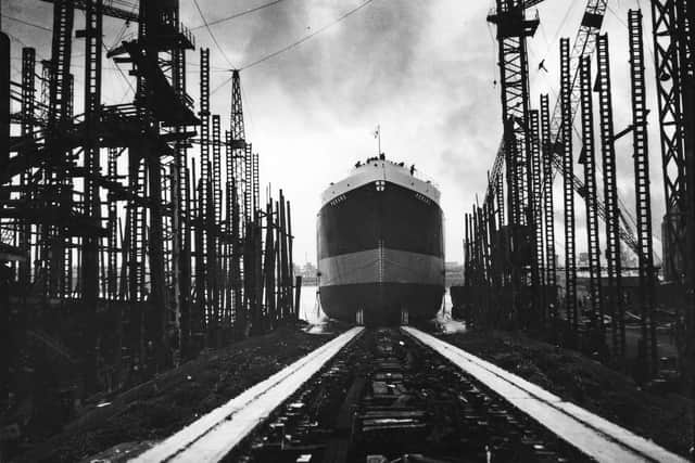 A ship built by the shipbuilders at Grays shipyard heads down the slipway following its naming ceremony.