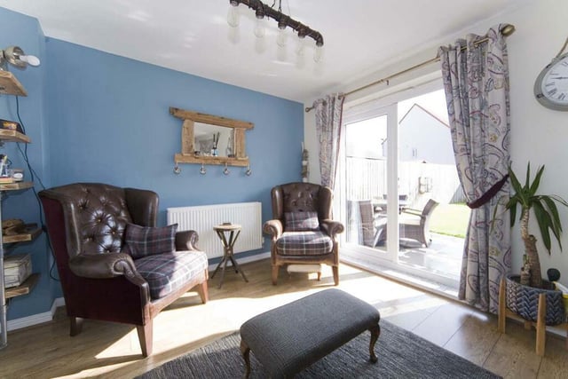 This cosy space backs onto the open plan kitchen and offers a great space to relax in the sun.