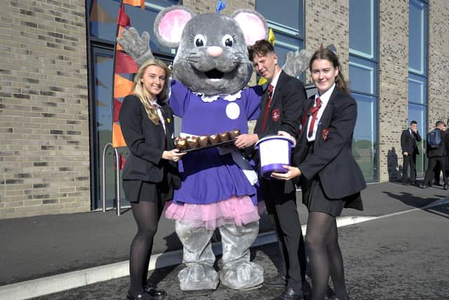 Hospice mascot Alice Mouse with English Martyrs School and Sixth Form College students (left to right) Holly Ferguson, Jack Broenless, and Emma McNeil. Picture by FRANK REID