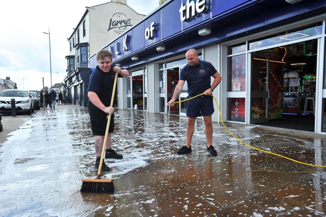 Nathan Convillie (left) and James Bryan scrub the pavement outside of Talk Of The Town Seaton Carew.