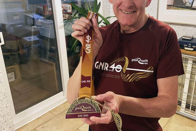Phil Holbrook with his Great North run medal commemorating its 40th year. Picture by FRANK REID.