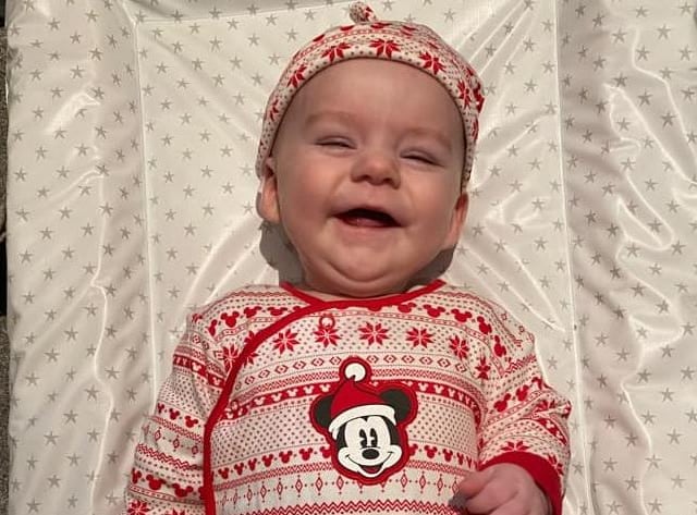 Oscar, age 5 months, ready to celebrate Christmas.