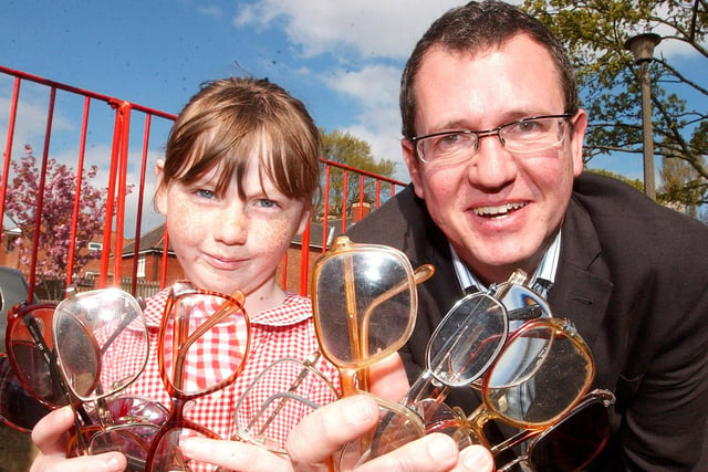Pupils at St Aidan's Primary School collect glasses for Specsavers in 2006.