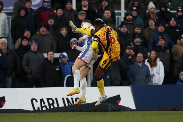 Rochdale's Ethan Ebanks-Landell catches Hartlepool United's Jack Hamilton with a high kick resulting in his sending off. (Credit: Mark Fletcher | MI News)
