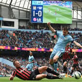 Queens Park Rangers' English defender Clint Hill (L) vies for the ball with Manchester City's English midfielder James Milner during the English Premier League football match between Manchester City and Queens Park Rangers at the Etihad Stadium in Manchester, northwest England, on May 10, 2015.  AFP PHOTO / PAUL ELLIS