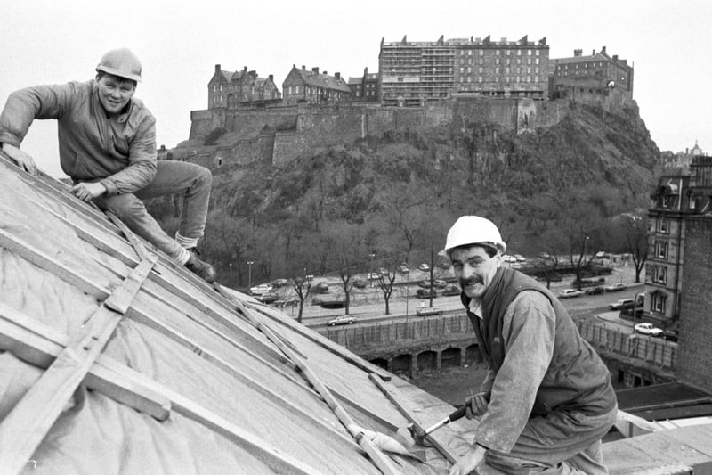 Builder Frank Devlin and builder's mate Stewart Munro replace the copper on the roof of the usher Hall theatre in Edinburgh in February 1987.