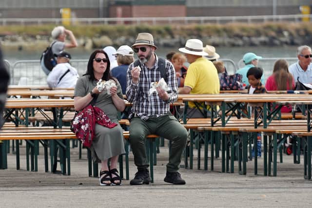 Visitors enjoying refreshments on the last day of the Tall Ships. Picture by BERNADETTE MALCOLMSON