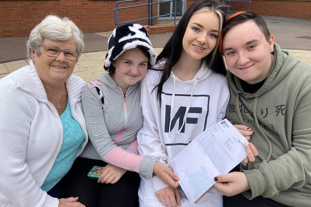 Chloe Carr shares her GCSE results with members of her family at Wellfield School. Picture by FRANK REID