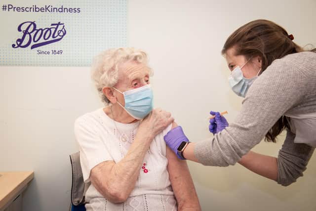 Brenda Clegg, 92, receiving the vaccination from pharmacist Rae Hynes at a Boots in Halifax. They are now to be provided at Anchor Retail Park in Hartlepool. Picture by Will Johnston Photography.
