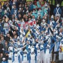 Hartlepool United fans dress up as smurfs during the League One match with Charlton Athletic at The Valley in 2012.  (Photo by Phil Cole/Getty Images)
