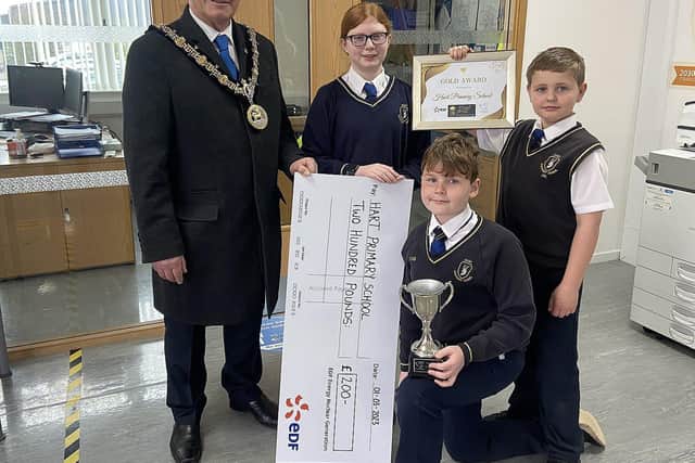 Mayor of Hartlepool Cllr Brian Cowie presents the winners trophy and cheque to Hart Primary School pupils. Picture by FRANK REID