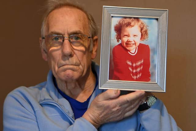Richard Lee holding a picture of his missing daughter Katrice. Picture by FRANK REID