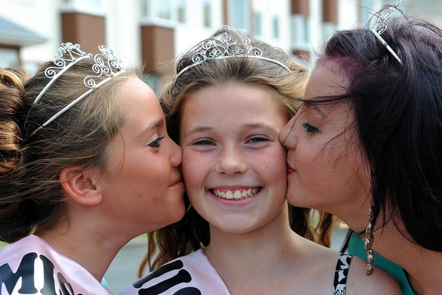 Headland Carnival Princess Robyn McLeod gets a kiss from Chloe Gough and Tannika Thomas in 2011.