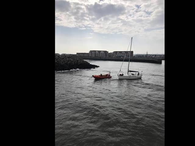 Hartlepol RNLI ILB 'Solihull' and volunteers crew with the yacht that had ran aground at the entrance to Hartlepool Marina./Photo: RNLI/Robbie Maiden