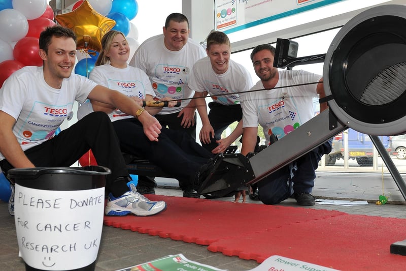 Tesco Extra employee Steph Edge on a rowing machine during a national drive to raise £500,000 for Cancer Research in 2012 with fellow rowers (left to right) Tom Channing, Jon Bond, Tim Ianson and Nick Hornsley.  Picture by FRANK REID