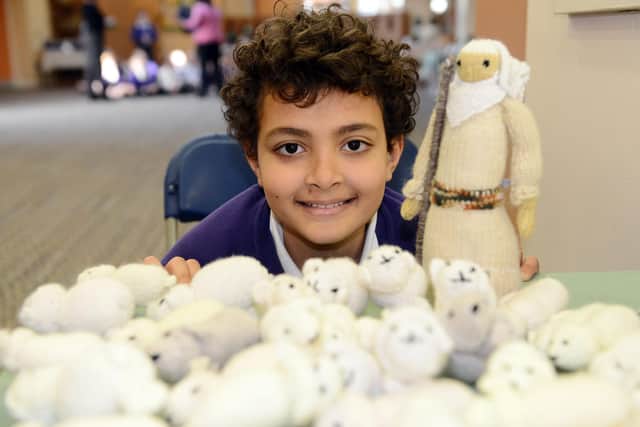 Cleadon Church of England Academy pupil Joshua Markqick with the shepherd and his flock as part of the Knitted Bible. Picture by FRANK REID