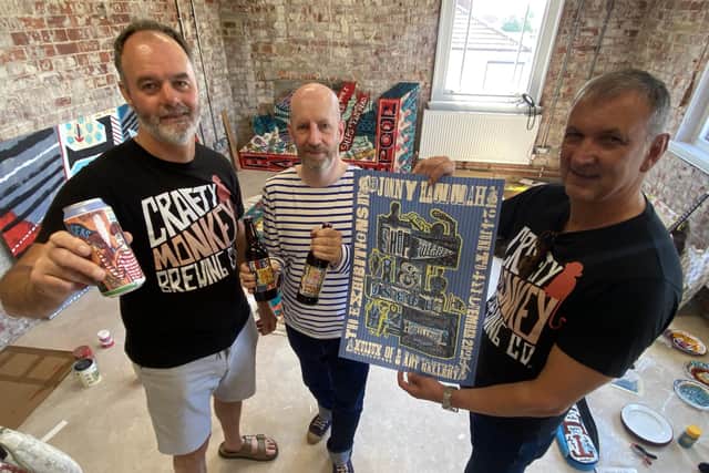 Artist Jonny Hannah (centre) with Pat Garrett (left) and Gary Olvanhill from Crafty Monkey Brewing Company at the launch of their new beers for the Hartlepool Tall Ships Races and Jonny's new exhibition. Picture by FRANK REID
