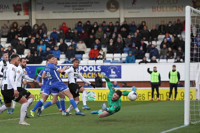 Nicky Featherstone's shot beats Notts County's Joe McDonnell to give Hartlepool United a 2-0 lead during the Vanarama National League match between Hartlepool United and Notts County at Victoria Park, Hartlepool on Saturday 22nd February 2020. (Credit: Mark Fletcher | MI News)