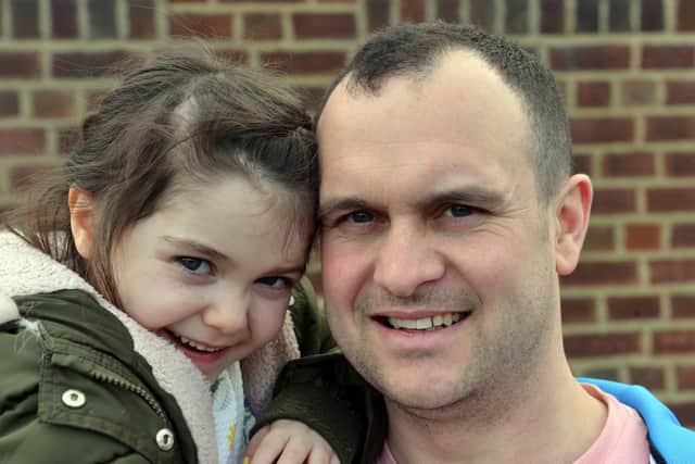 Lyla with her dad Paul who has completed challenges for his daughter's charity, including climbing the equivalent steps of Mount Everest in a day.
