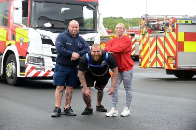 Miles for Men founder Micky Day Strongmen event with bodybuilder Adam Marshall and England's strongest woman, Rachael Greathead, who are to pull a fire appliance.