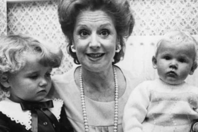 Barbara Knox with two young fans during a visit to Hartlepool.