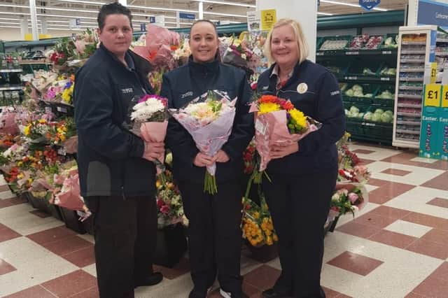 Workers of Tesco in Billingham with some of the flowers they gave to NHS workers.
