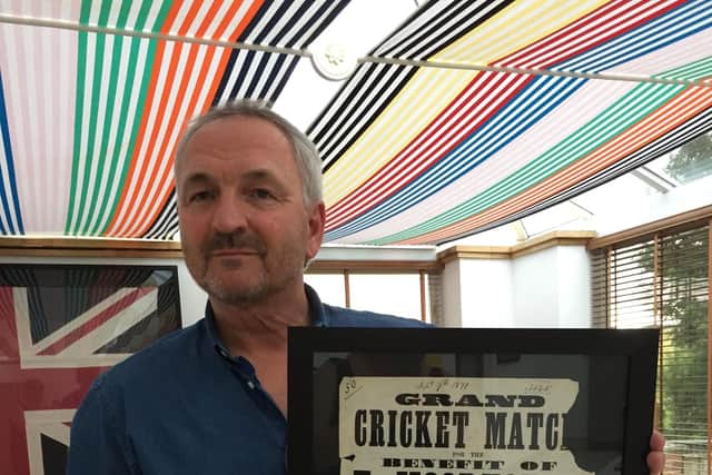 Stephen Close with the 150-year-old Hartlepool cricket match poster which is being auctioned off.