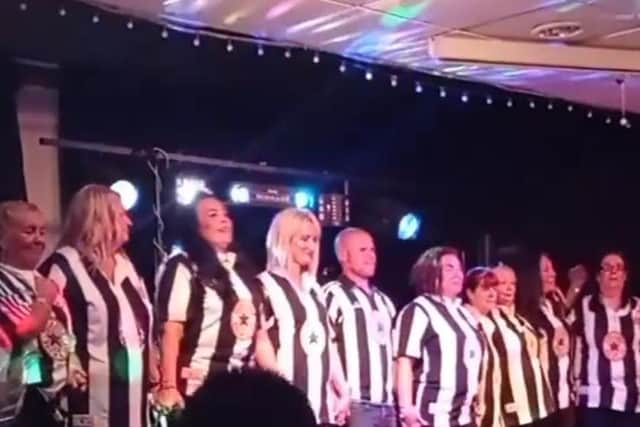 The group of Danny's friends and family sang some of his favourite songs dressed in Newcastle United shirts.