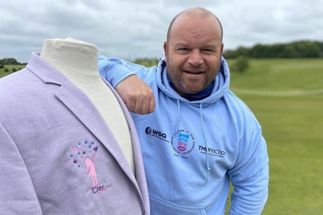 Micky Day with one of the special lilac jackets for the winners of the Miles For Men golf fundraising day. Picture by FRANK REID