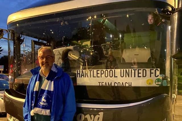 Author and Hartlepool United fan Stephen Poxon pictured next to the team coach.