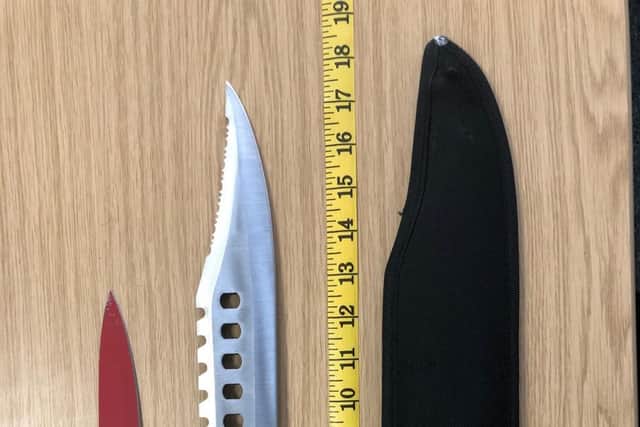Some of the knives recovered with their sizes measured by tape.