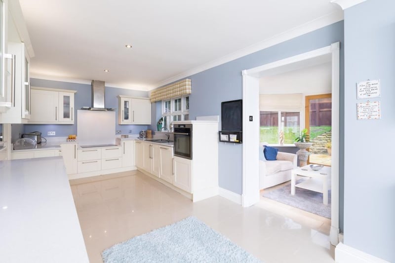 Featuring granite worktops and an island, the fully equipped kitchen also provides access to a conservatory, ideal for dining in the summer months.
