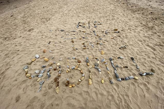A message made in stones on the sand at Seaton Carew in memory of Gabriel Kariuki  Picture by Frank Reid.