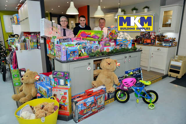 MKM staff, left to right, Lee Dees, Neil Reed and Mick Sumpter with Christmas gifts at a previous appeal.