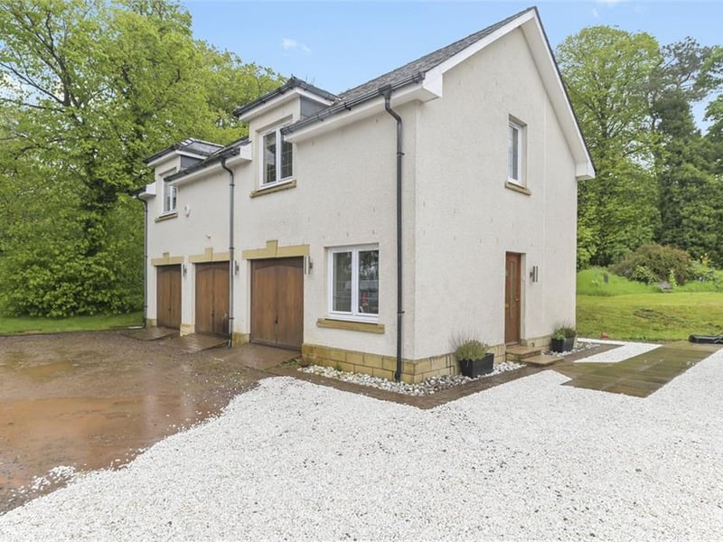 Triple garage with separate annexe above.