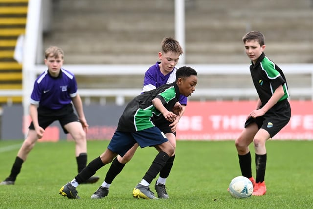 Manor, green and black, versus Dyke House in the year eight boys' cup final. Picture by FRANK REID