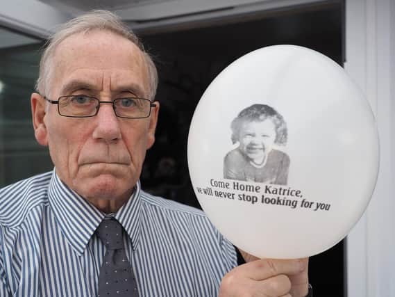 Richard Lee with a balloon featuring a photograph of his daughter Katrice. Picture by FRANK REID