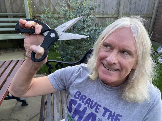 Snip Snip. Charity runner Phil Holbrook is taking part in Brave The Shave in aid of Alice House Hospice and Macmillan.