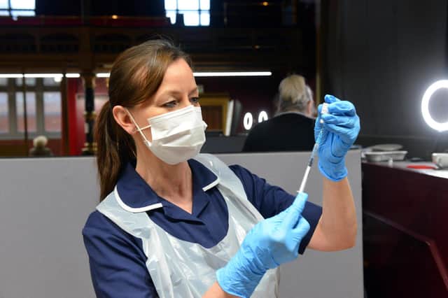 Nurse practioner Julie Faint preparing doses of the vaccine at a clinic at Hartlepool Town Hall Theatre.