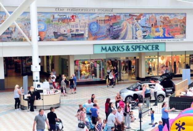 The mural was positioned above the Marks & Spencer.