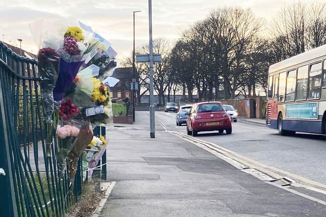 Flowers and messages left at the scene of the collision. Picture by FRANK REID