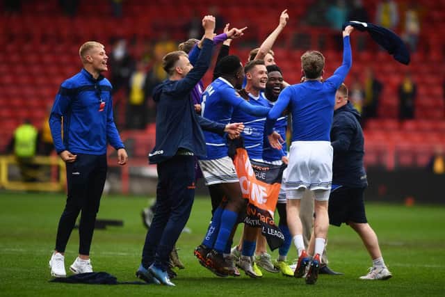 Players of Hartlepool United celebrate following the Vanarama National League Play-Off Final match between Hartlepool United and Torquay United at Ashton Gate on June 20, 2021 in Bristol, England. (Photo by Harry Trump/Getty Images)