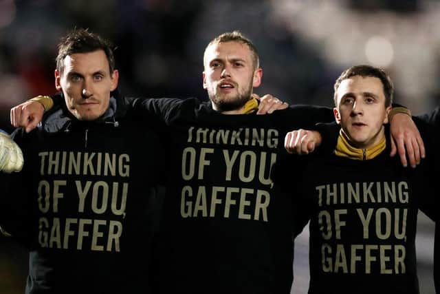 James Wilson of Port Vale (C) wears a t-shirt in support of Darrell Clarke, Manager of Port Vale (not pictured) prior to the Sky Bet League Two match between Rochdale and Port Vale at Crown Oil Arena. (Photo by Lewis Storey/Getty Images)