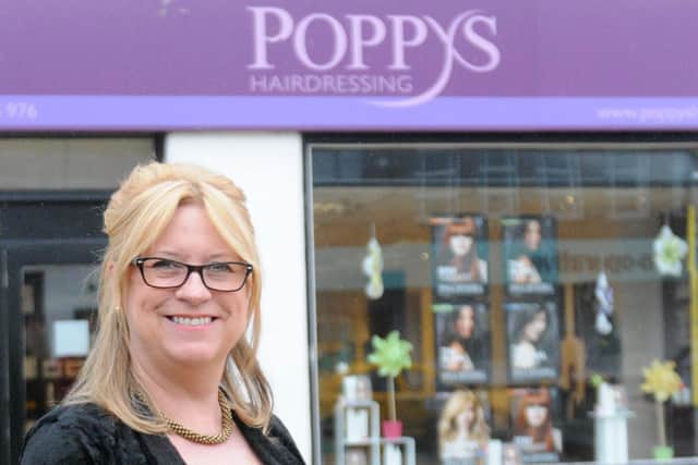 Janice Auton of Poppys Hairdressers which has been rearranging appointments following the latest lockdown announcement.
