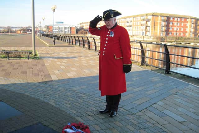 Chelsea Pensioner David Lines lays a wreath in memory of his seaman uncle Joseph Sculley from Hartlepool who was killed during the Second World War.