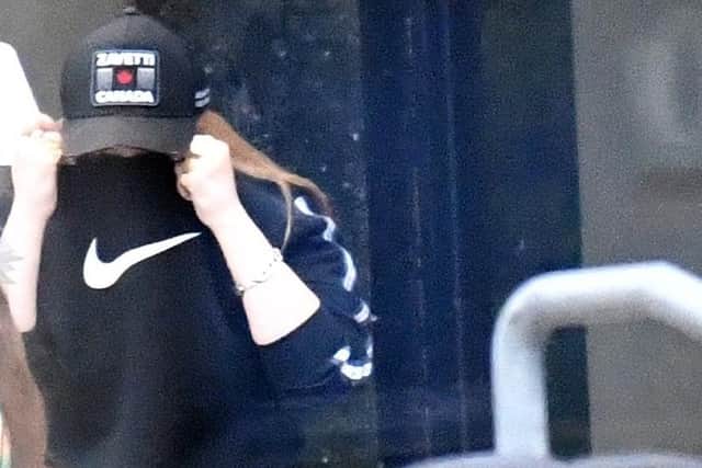 Hollie Hay hides her face as she leaves Teesside Magistrates' Court.