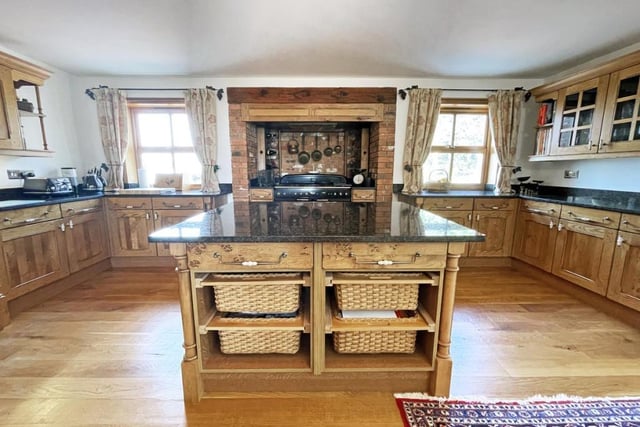 The impressive kitchen boasts a feature Aga range cooker.