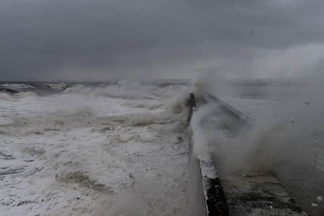File picture to demonstrate how high and dangerous the waves can be when crashing over Heugh Pier.