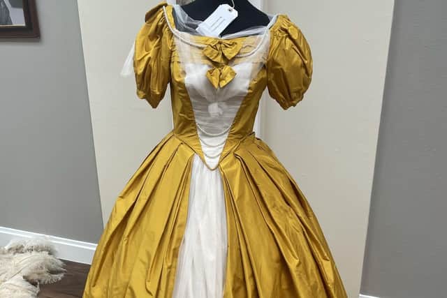 'Princess Charlotte' golden dress at the Script to Screen exhibition in the Picture Gallery at Heatherden Hall, Pinewood Studios.