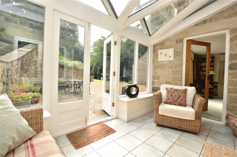 Bright and airy, the conservatory serves as another sitting room and enjoys wonderful views over the garden, with double doors leading outside.